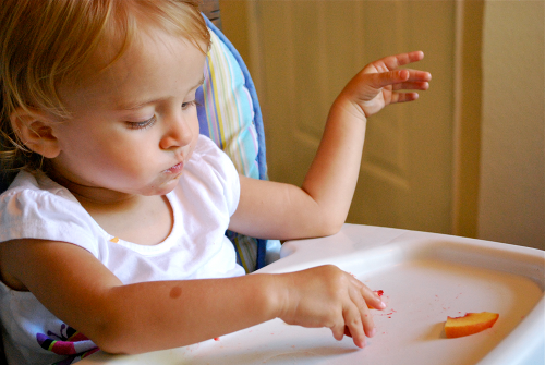 Jordan Eating a Peach images of Community Supported Agriculture by Lacey Stevens-Baier, a sweet pea chef