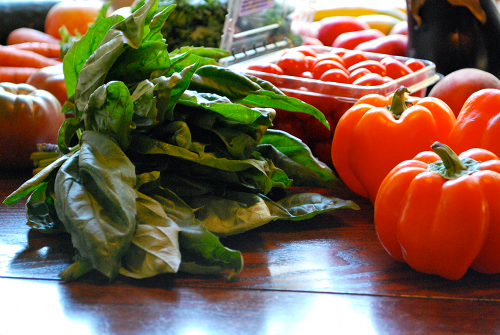 Organic Sweet Basil and Orange Peppers images of Community Supported Agriculture by Lacey Stevens-Baier, a sweet pea chef