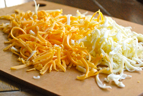 Grated Monterrey Jack and Cheddar Shredded Chicken Enchiladas recipe and images by Lacey Baier, a sweet pea chef