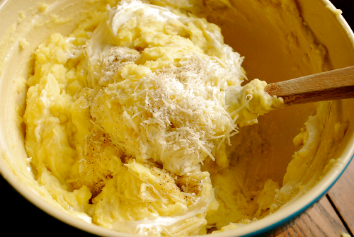 Mixing Parmesan and Sour Cream into Potatoes Parmesan Mashed Potatoes recipe and images by Lacey Baier, a sweet pea chef