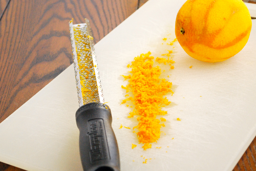 Freshly Grated Orange Zest Orange-Scented Blueberry Muffins recipe and images by Lacey Baier, a sweet pea chef