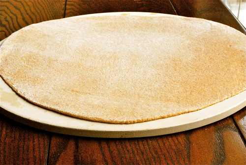 Pizza Dough Rolled Out onto Stone Honey Whole Wheat Pizza Dough recipe and images by Lacey Baier, a sweet pea chef