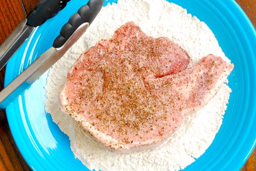 Dredging the Chop in the Coating Best Pork Chops recipe and images by Lacey Baier, a sweet pea chef
