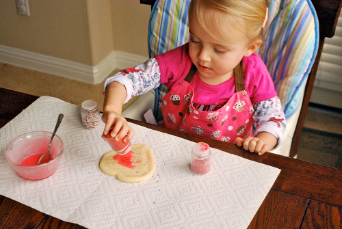 Jordan Decorating her Cookie How to Make Sugar Cookies, recipe and images by Lacey Baier, a sweet pea chef