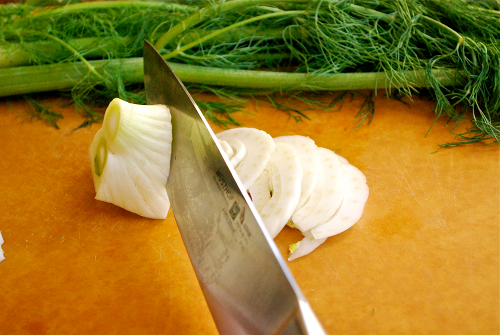 Slicing the Fennel Bulb Roasted Fennel and Italian Sausage Pizza with Garlic White Sauce by Lacey Baier, a sweet pea chef