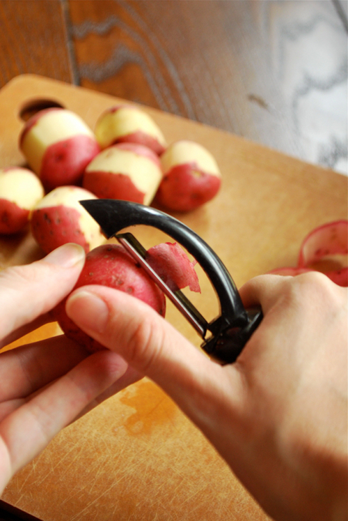 Peeling the Baby Potatoes Sautéed Baby Red Potatoes recipe and images by Lacey Baier, a sweet pea chef