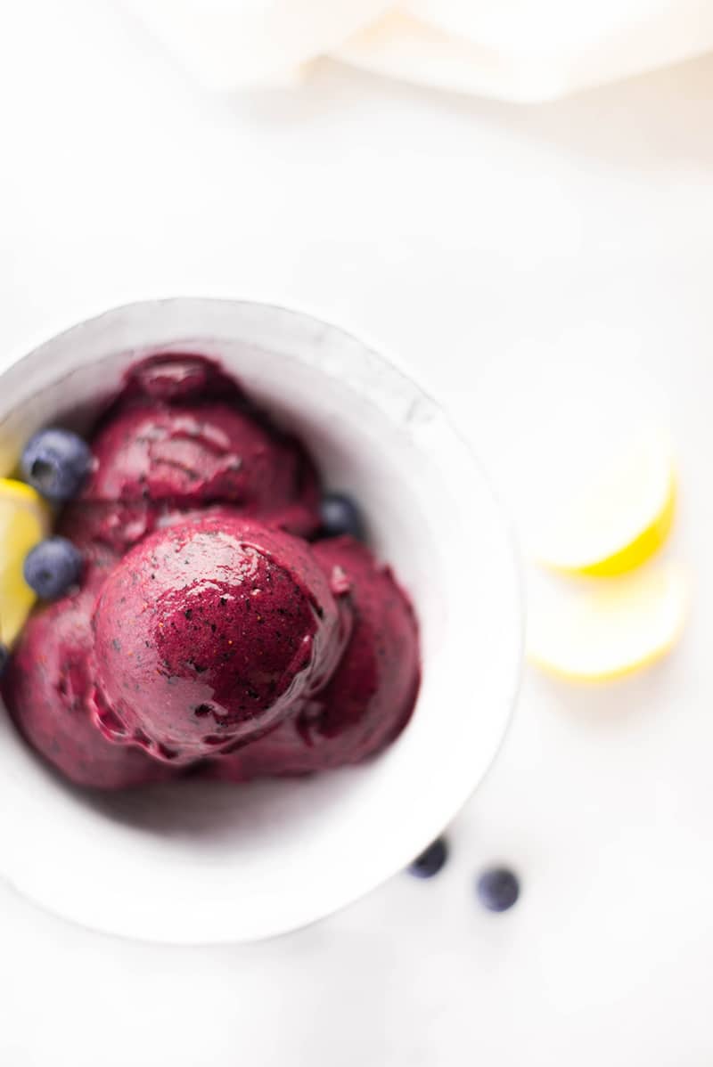 Close up of lemon blueberry sorbet served in a bowl, ready to be enjoyed 