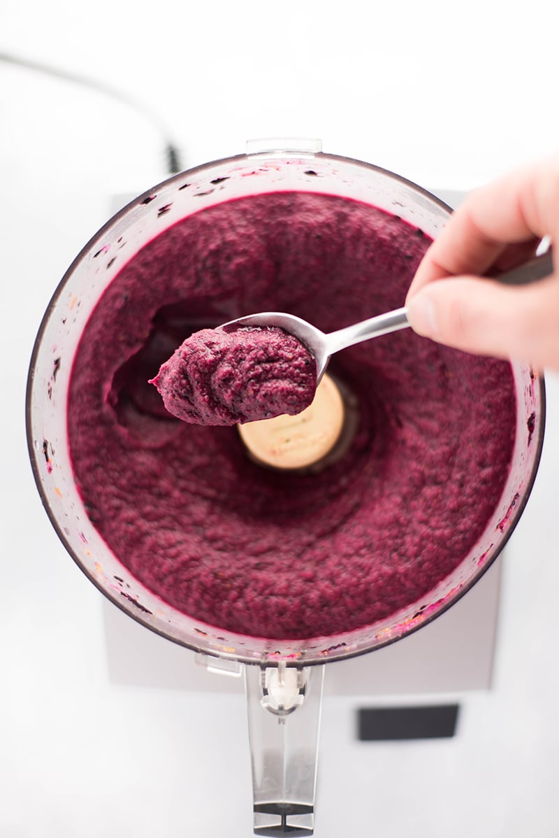 Spoonful of lemon blueberry sorbet mixture, after having been processed in a food processor 