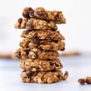 Stack of healthy oatmeal raisin cookies. Sitting on top of a light marble countertop.
