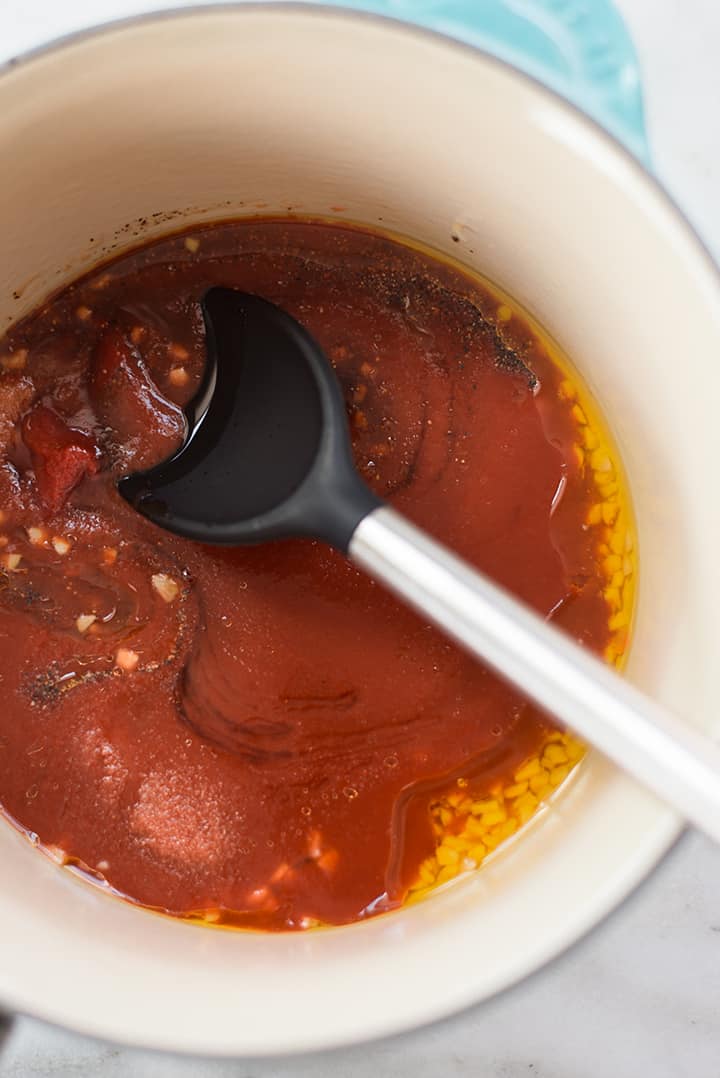 Overhead image of sauce pan filled with the ingredients to make sweet bbq sauce.
