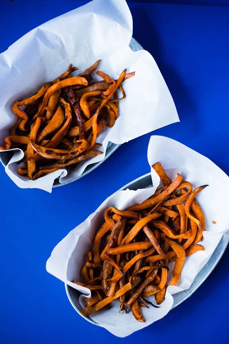 Two large baskets of oven baked sweet potato fries, showing how to make sweet potato fries in the oven.