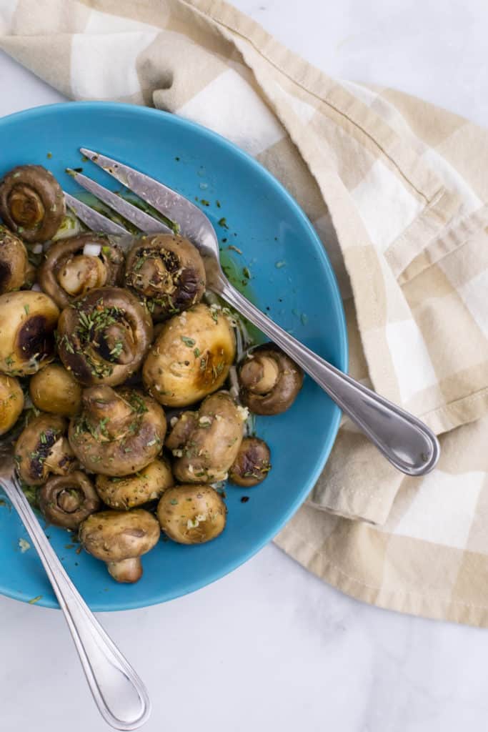Marinated mushrooms are savory bite-sized pieces of yummy goodness! Want to know how to make the tastiest marinated mushrooms ever? Read on!