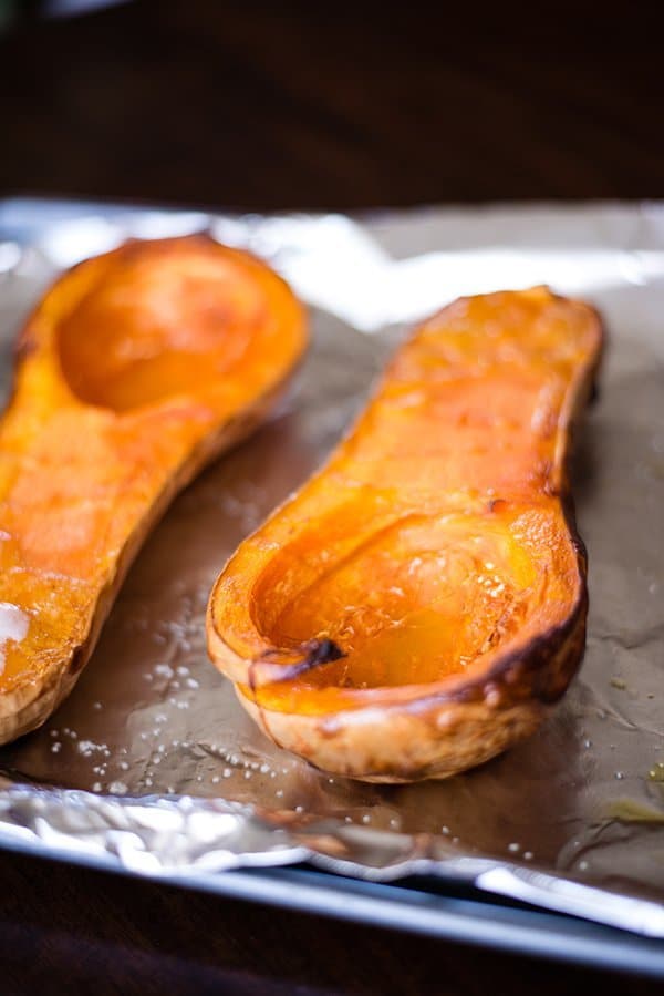 Close up of the roasted butternut squash that has been roasted in the oven and is ready to be removed from the skin and made into the roasted butternut squash soup.