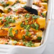 Shredded Chicken Enchiladas | These shredded chicken enchiladas are my absolute favorite enchilada recipe.  Tips for how to make the best chicken enchiladas ever, how to shred chicken, and a handy 10 minute enchilada sauce are all included!  | A Sweet Pea Chef