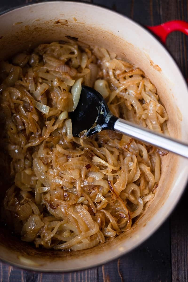 Caramelized onions in a heavy ceramic pot, ready to be included in the Healthy French Onion Soup recipe.