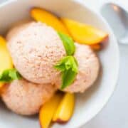 Peach Ice Cream | Make this healthy and absolutely creamy Peach Ice Cream at home, in a matter of minutes and without an ice cream maker. Tastes like summer! | A Sweet Pea Chef