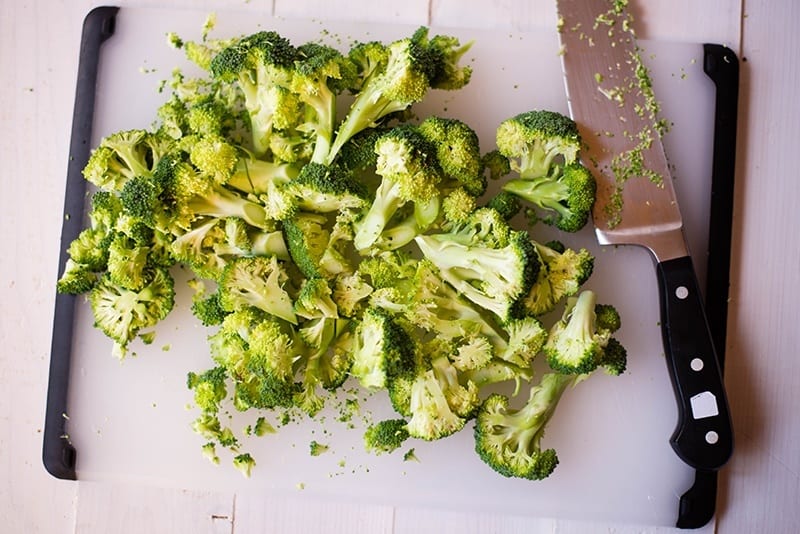 Chopped fresh raw broccoli florets, ready to cook to make the easy cream of broccoli soup.