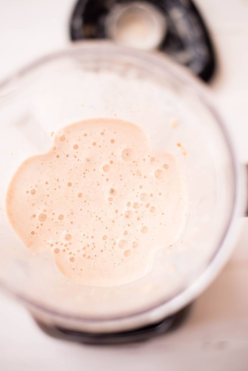 Close up of the oatmeal raisin cookie protein shake, right after being pulsed in a blender 
