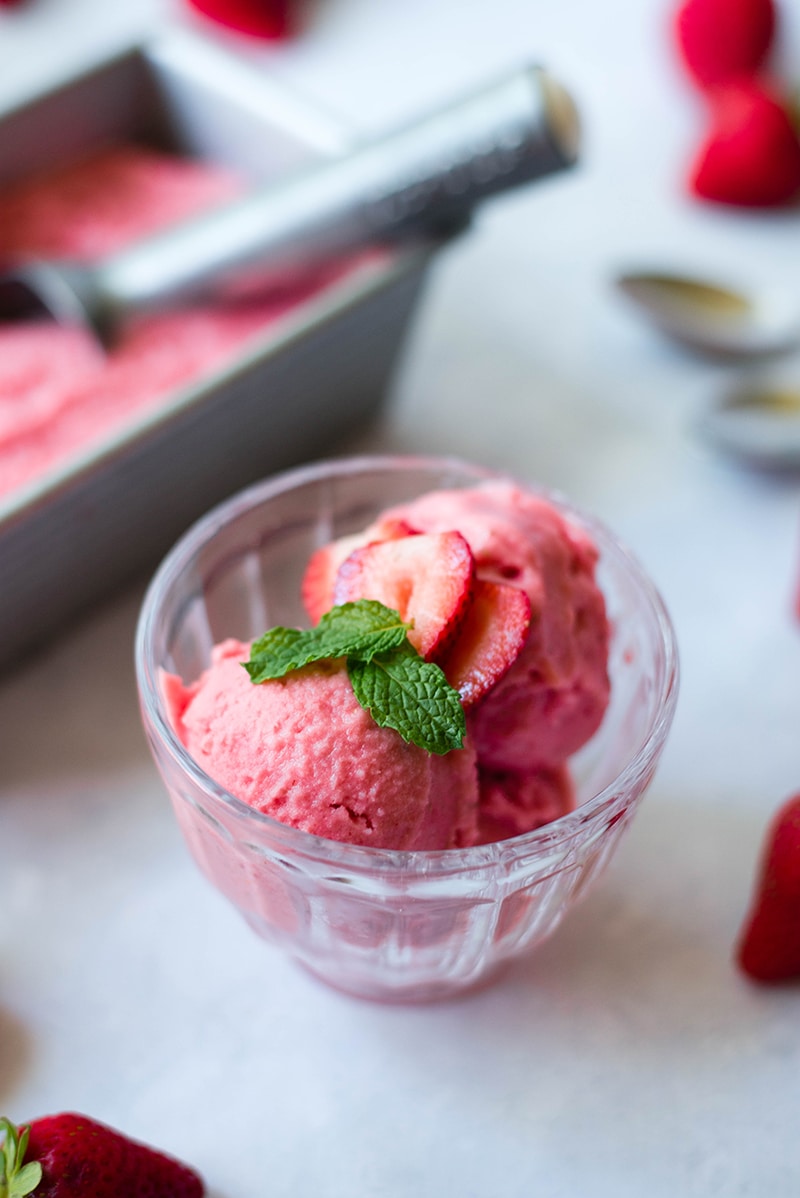 Serving of strawberry frozen yogurt, ready to be served and enjoyed 