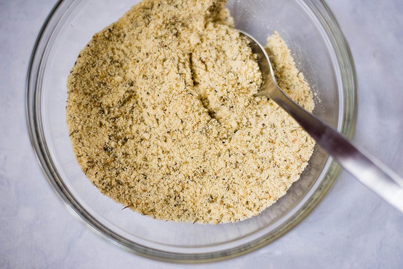 A bowl of all the herbs and ingredients used to make the healthy gluten-free coating for the healthy chicken Parmesan dish
