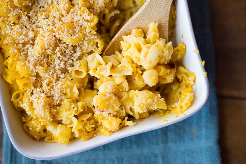 Healthy mac and cheese that has been baked and contains quinoa noodles covered in a butternut squash cheese sauce to make it a clean eating mac and cheese.