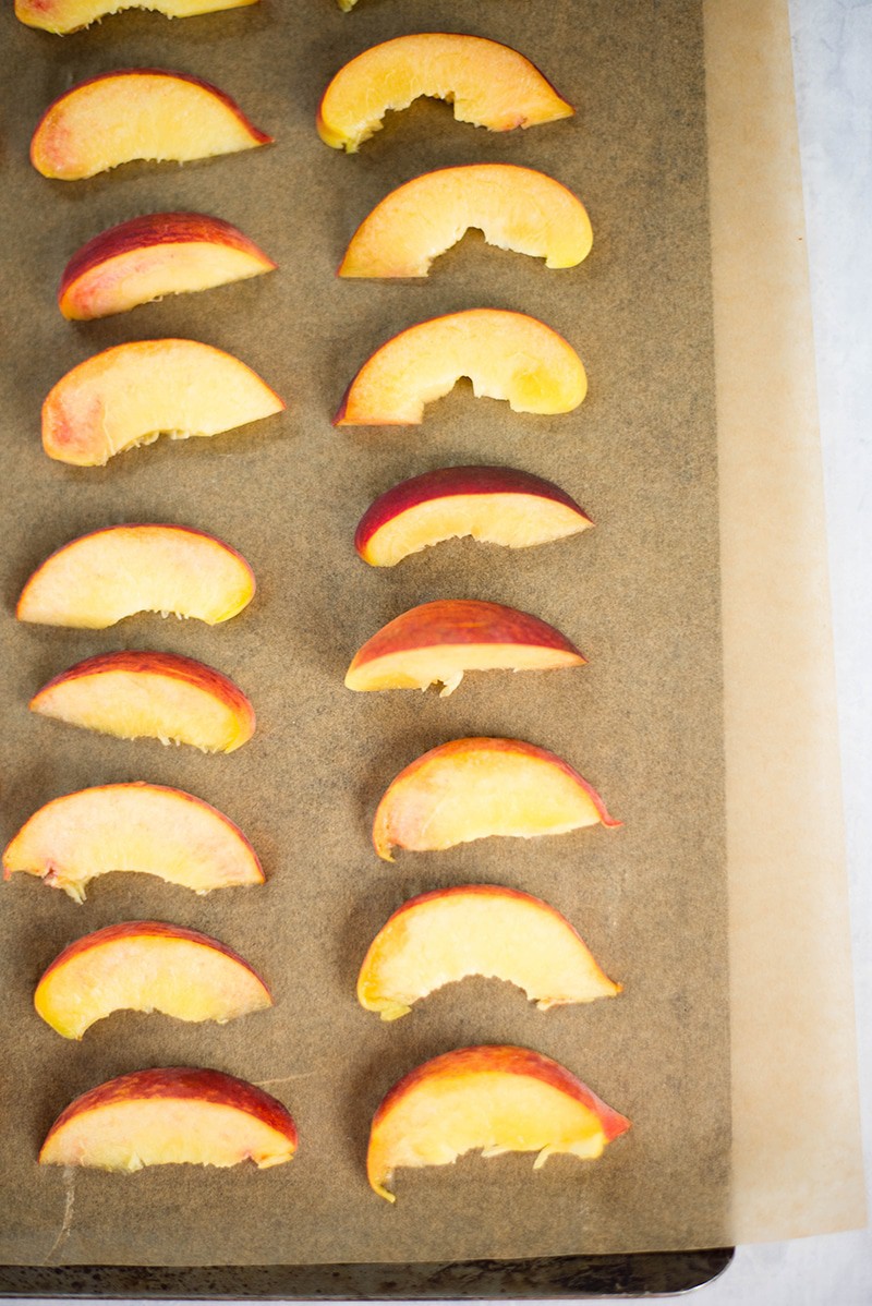 Fresh peaches, sliced into wedges, ready to make frozen peach yogurt 