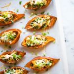 Sweet Potato Skins | For a healthy appetizer idea, try these baked sweet potato skins that have been stuffed with seasoned chicken, cooked spinach, and greek yogurt.  Easy to make and healthy for you! | A Sweet Pea Chef