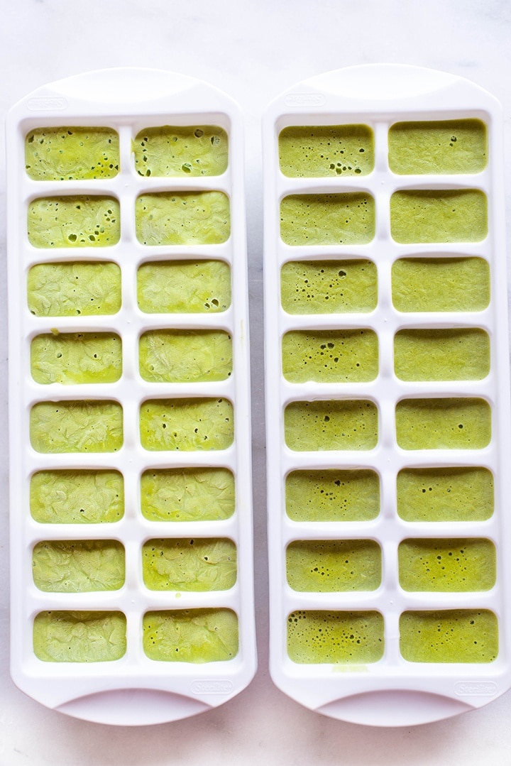 Silky smooth, green tea yogurt mixture poured into an ice cube tray, ready to be transferred to the freezer to solidify into Matcha yogurt cubes 