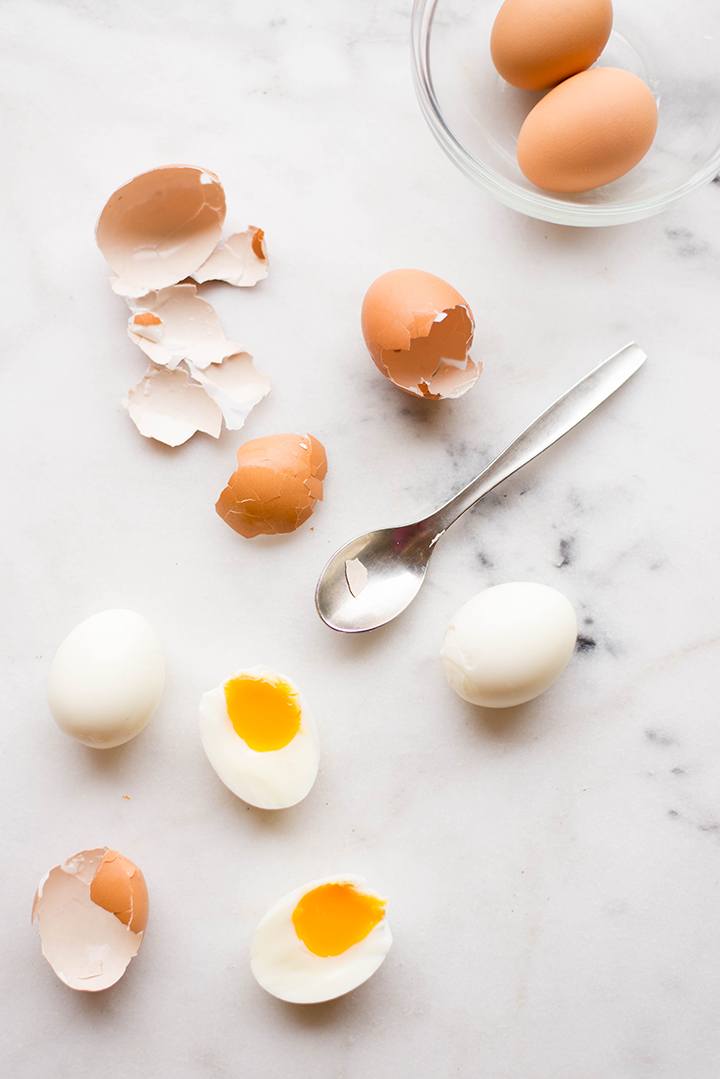 Overhead view of soft boiled eggs after removal from the shell, ready to be used on Perfect Avocado Toast.