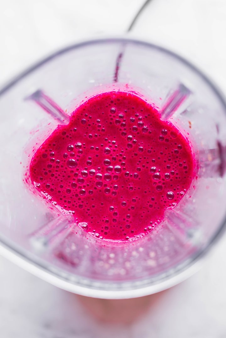 The beet smoothie after being blended in the blender - showing how the color is hot pink.