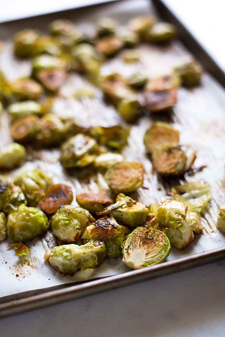 The roasted brussels sprouts are ready to eat and are tender and golden brown.