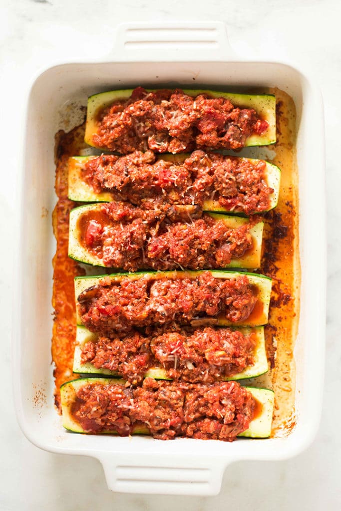The turkey and quinoa stuffed zucchini boats have been baked in the oven and are ready to eat.
