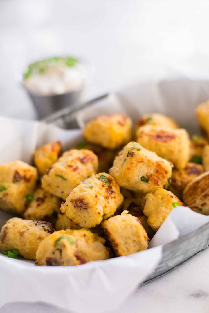Tin of baked loaded cauliflower tots that are ready to grab and enjoy.