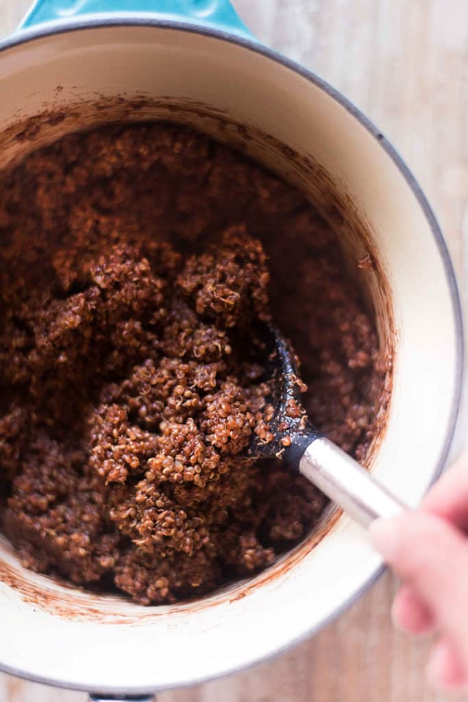 The chocolate quinoa for the Chocolate Quinoa Breakfast Bowl is completely mixed together in the sauce pan and is ready to transfer to a bowl.