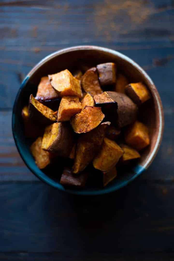 Bowl of roasted sweet potatoes that is added to the meal for how to meal prep chicken for added starch in the healthy meal prep.