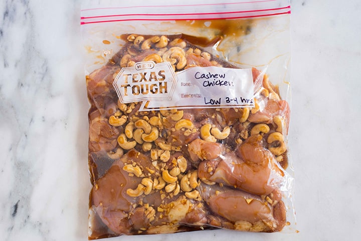 Ziploc bag filled with cashew chicken to make slow cooker cashew chicken freezer meal.