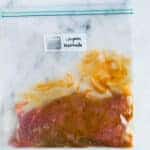 Sealable freezer bag with steak and the Chipotle Marinade, marinating and ready to cook.