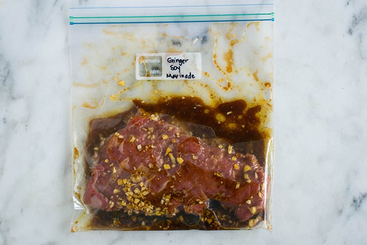 Sealable freezer bag with skirt steak and the Ginger Soy Marinade, marinating and ready to cook.