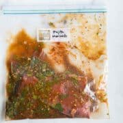 Sealable freezer bag with skirt steak and the Fajita Marinade, marinating and ready to cook.