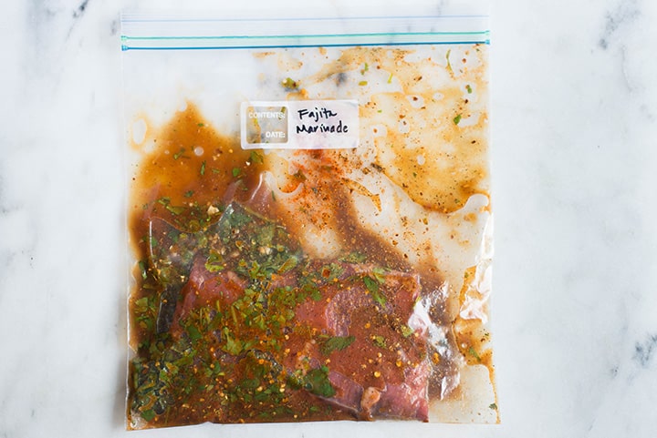 Sealable freezer bag with skirt steak and the Fajita Marinade, marinating and ready to cook.