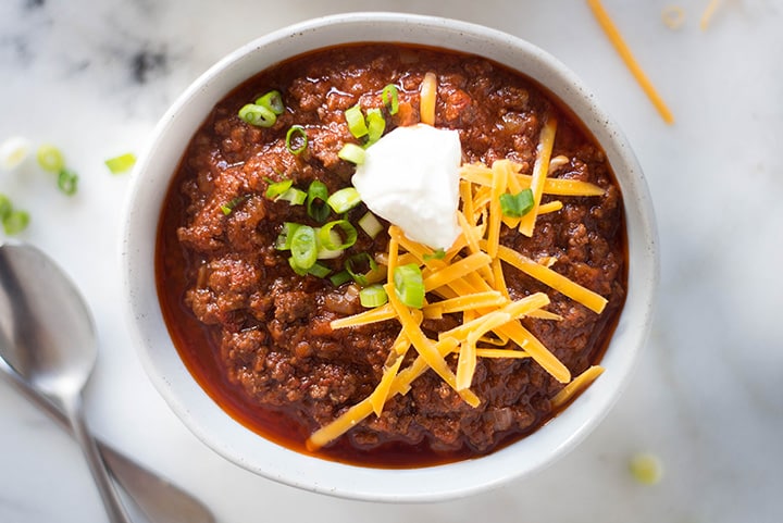 Horizontal image of a singular bowl of a Texas chili recipe which is used to celebrate Texas Independence Day.