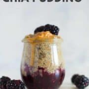 Single jar of PB&J chia pudding which is layered with smashed blackberries for the jam and creamy peanut butter chia for the chia pudding recipe.