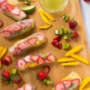 These fruity Kiwi Strawberry Spring Rolls are a burst of flavor and are super addicting, especially when dipped into the Honey Lime Sauce. A perfect summer dessert! One of the five healthy spring roll recipes.