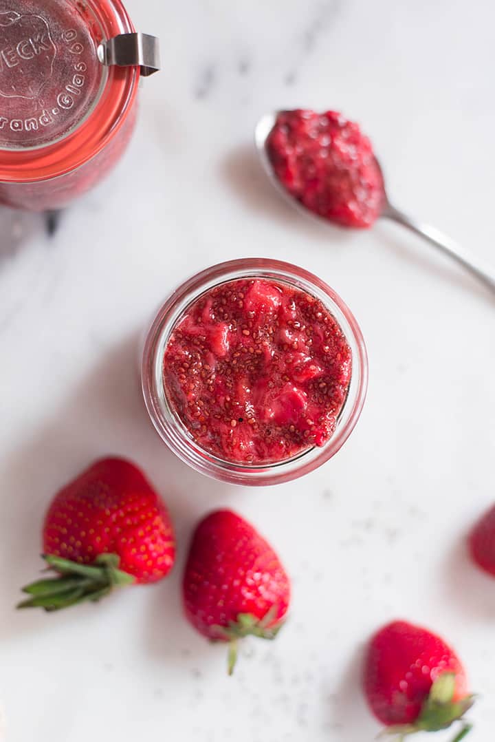 Close up of a jar of strawberry chia seed jam.