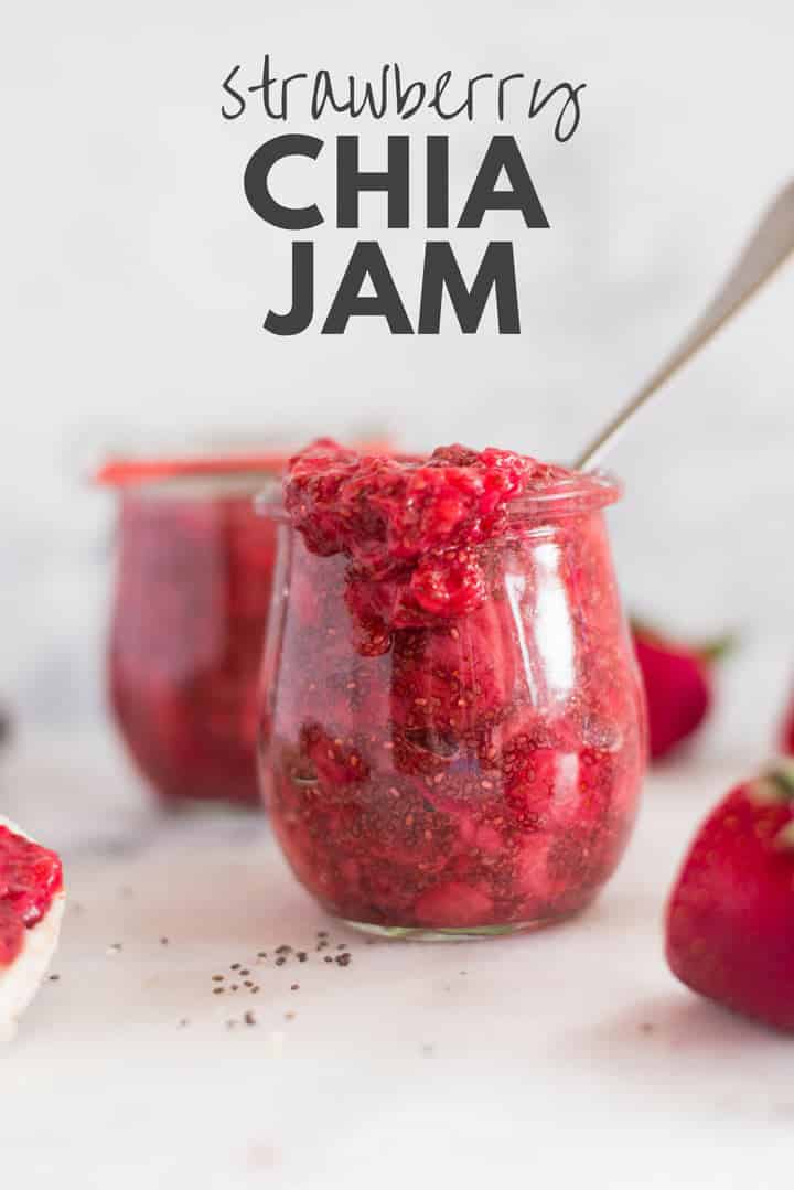 A side image of a glass jar filled with Homemade Strawberry Chia Jam made from fresh strawberries, chia seeds, and raw honey.