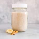 Banana Bread Smoothie, one of the Easy Make Ahead Smoothies for Fall, in a jar.