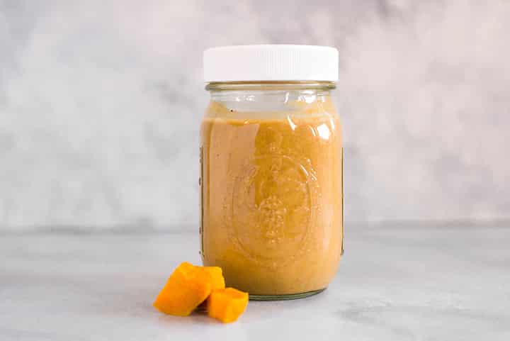 close up side view of a Maple Cinnamon Sweet Potato Smoothie, one of the Easy Make Ahead Smoothies for Fall, in a mason jar.