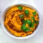 This easy to make, nutritionally packed sweet potato hummus is full of flavor. Savory vegetable goodness drizzled with healthy olive oil - who could ask for more?