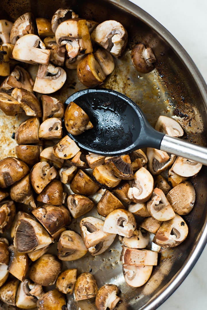 Overhead view of the mushrooms for the Easy Meal Prep Salisbury Steak with mushroom gravy being sauteed in a skillet.