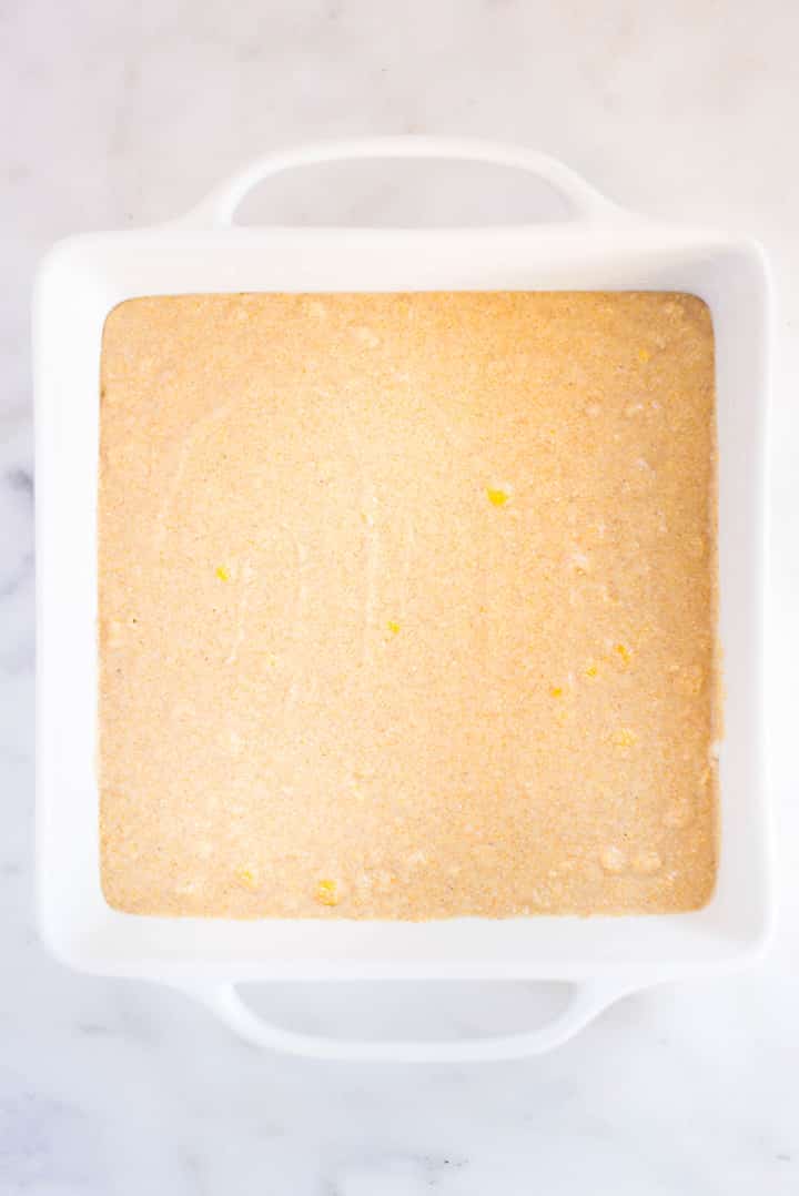 The cornbread mixture in a pan ready to be transferred to the oven to be baked. 